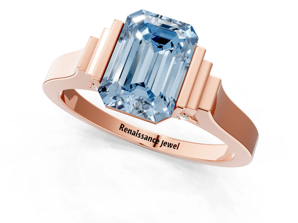Rose gold Fancy Blue Emerald Cut Brilliant Solitaire Diamond Ring with Channel Set Band and Bar Prong Setting