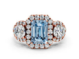 Rose gold Fancy Blue Emerald Cut Diamond Three-Stone Halo Ring with Prong Setting and Pavé Accents
