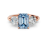 Rose gold Fancy Blue Emerald Cut Diamond Three-Stone Ring with Prong Setting and Pavé Band