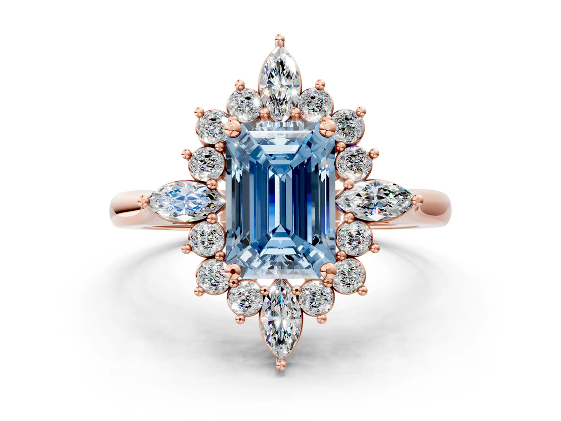 Rose gold Fancy Blue Emerald Cut Halo Diamond Cluster Ring with Marquise and Round Stones on a White Gold Band with Prong Setting