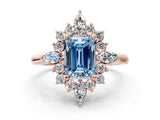 Rose gold Fancy Blue Emerald Cut Halo Diamond Cluster Ring with Marquise and Round Stones on a White Gold Band with Prong Setting
