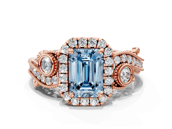 Rose gold Fancy Blue Emerald Cut Halo Diamond Ring with Milgrain and Bezel Accents on a Split Shank Band
