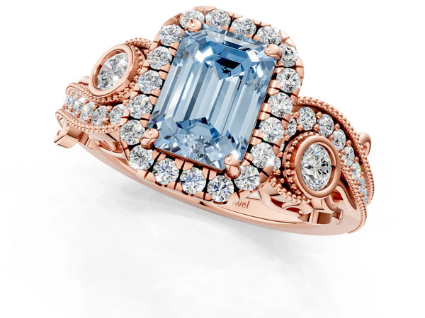 Rose gold Fancy Blue Emerald Cut Halo Diamond Ring with Milgrain and Bezel Accents on a Split Shank Band