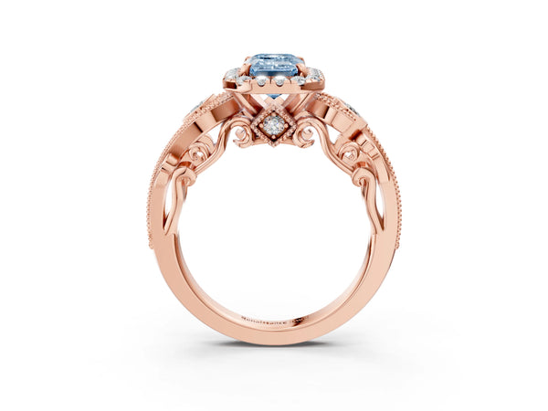 Rose gold Fancy Blue Emerald Cut Halo Diamond Ring with Milgrain and Bezel Accents on a Split Shank Band