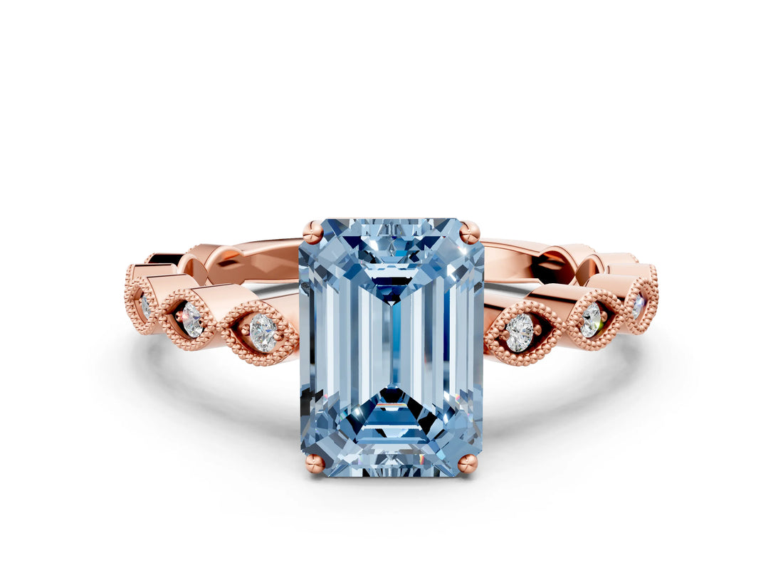 Rose gold Fancy Blue Emerald Cut Solitaire Diamond Ring with Infinity Twist Band and Four-Prong Setting