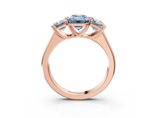 Rose gold Fancy Blue Emerald Cut Three-Stone Diamond Ring with Prong Setting on a Classic Band