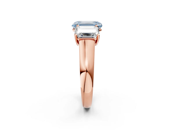 Rose gold Fancy Blue Emerald Cut Three-Stone Diamond Ring with Prong Setting on a Classic Band