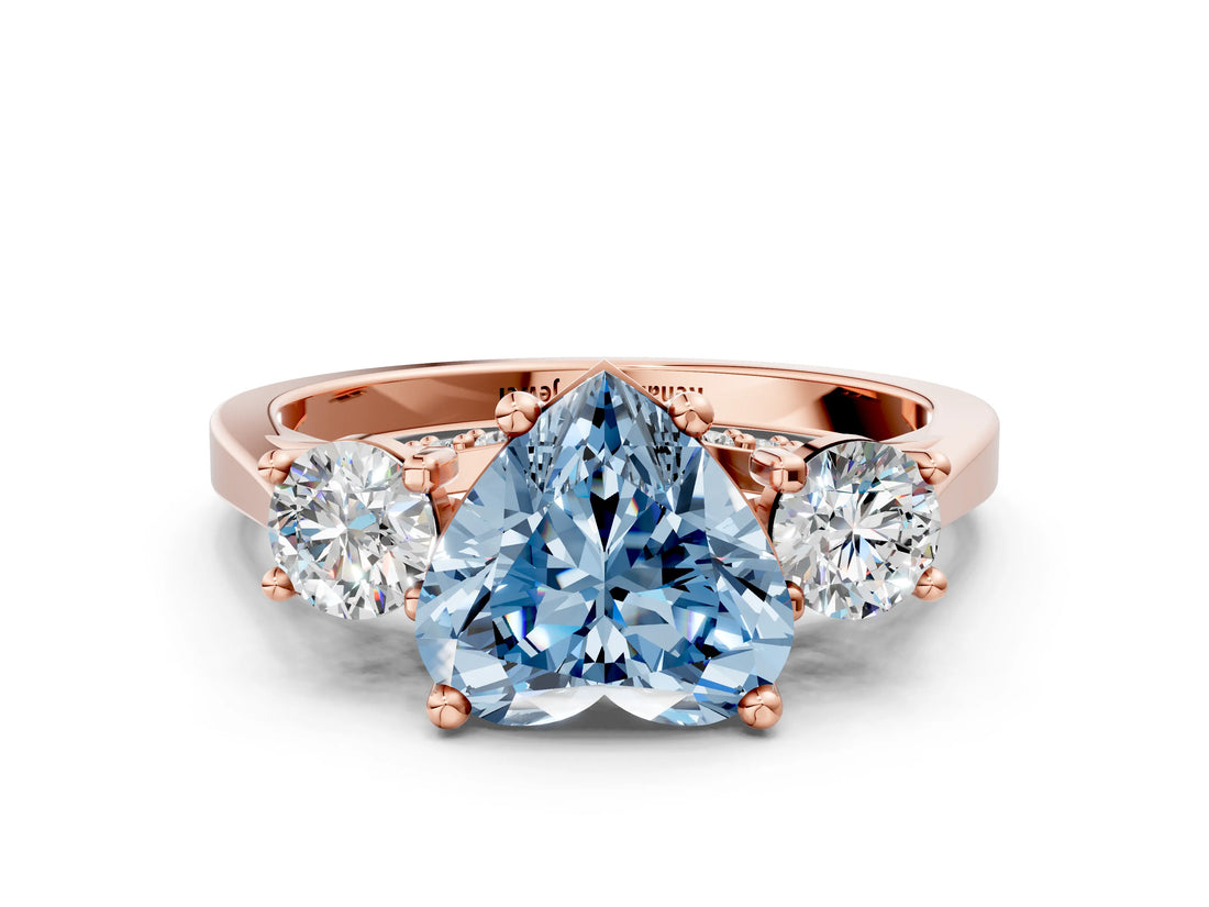 Rose gold Fancy Blue Heart Cut Diamond Three-Stone Engagement Ring with Prong Setting and Pavé Band