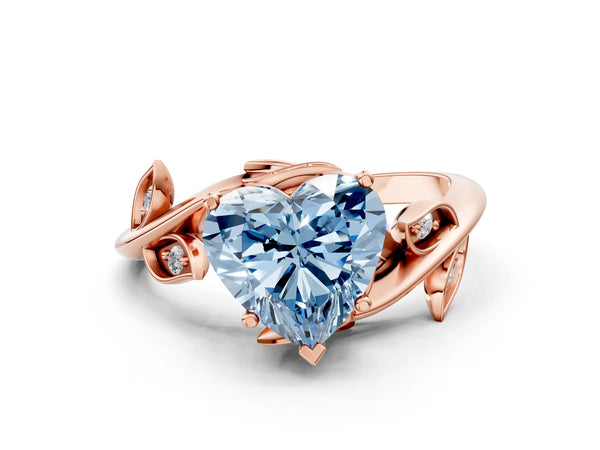 Rose gold Fancy Blue Heart Cut Solitaire Twist Engagement Ring with Leaf Accents and Prong Setting
