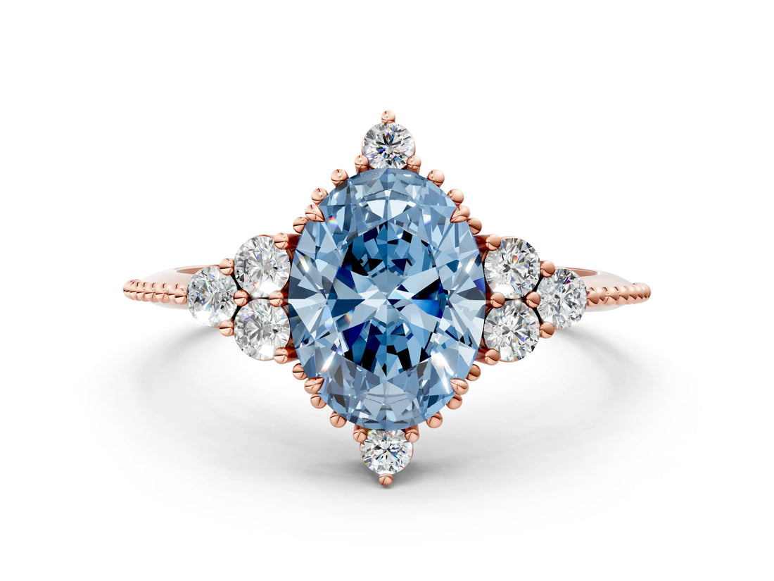 Rose gold Fancy Blue Oval Cut Brilliant Diamond with Cluster Setting on a Beaded Band and Four-Prong Setting