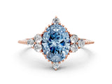 Rose gold Fancy Blue Oval Cut Brilliant Diamond with Cluster Setting on a Beaded Band and Four-Prong Setting