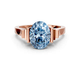 Rose gold Fancy Blue Oval Cut Brilliant Solitaire Diamond Ring with Channel Set Band and Bar Prong Setting