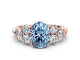 Rose gold Fancy Blue Oval  Cut Diamond Cluster Ring with Round Accent Stones and Prong Setting on a Classic Band_49