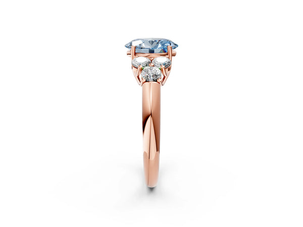 Rose gold Fancy Blue Oval  Cut Diamond Cluster Ring with Round Accent Stones and Prong Setting on a Classic Band