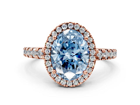 Rose gold Fancy Blue Oval Cut Diamond Halo Ring with Pavé Band and Four-Prong Setting