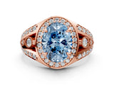Rose gold Fancy Blue Oval Cut Diamond Halo Ring with Split Shank and Bezel Accents and Four-Prong Setting
