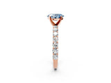 Rose gold Fancy Blue Oval Cut Diamond Solitaire Ring with Shared Prong Pavé Band and Four-Prong Setting_59