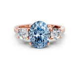 Rose gold Fancy Blue Oval Cut Diamond Three-Stone Engagement Ring with Prong Setting and Pavé Band