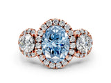 Rose gold Fancy Blue Oval Cut Diamond Three-Stone Halo Ring with Prong Setting and Pavé Accents
