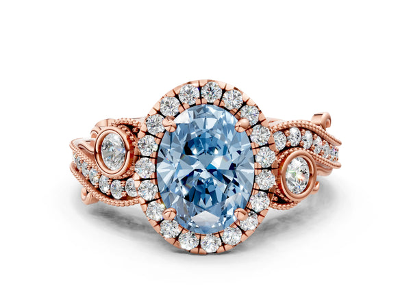 Rose gold Fancy Blue Oval Cut Halo Diamond Ring with Milgrain and Bezel Accents on a Split Shank Band