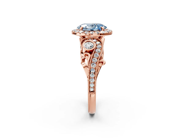 Rose gold Fancy Blue Oval Cut Halo Diamond Ring with Milgrain and Bezel Accents on a Split Shank Band