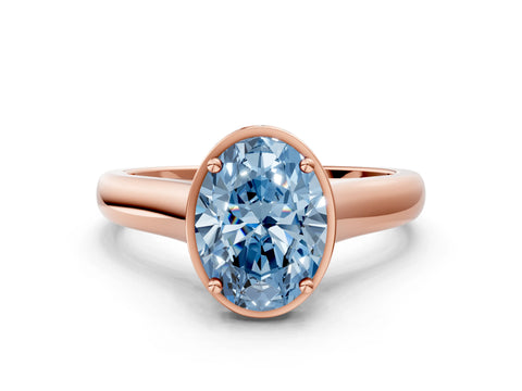 Rose gold Fancy Blue Oval Cut Solitaire Diamond Engagement Ring with Four-Prong Setting and Tapered Band