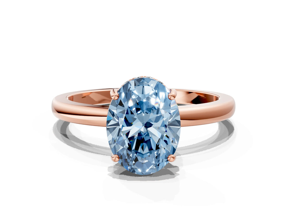 Rose gold Fancy Blue Oval Cut Solitaire Diamond Ring with Prong Setting and Plain Band