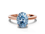 Rose gold Fancy Blue Oval Cut Solitaire Diamond Ring with Prong Setting and Plain Band
