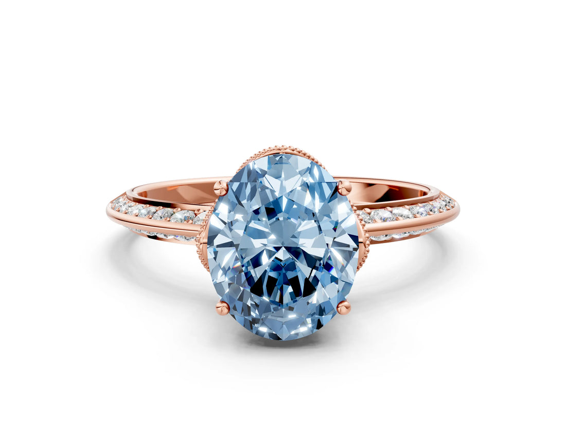 Rose gold Fancy Blue Oval Cut Solitaire Split Shank Pave Diamond Engagement Ring with Four-Prong Setting