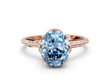 Rose gold Fancy Blue Oval Cut Solitaire Split Shank Pave Diamond Engagement Ring with Four-Prong Setting