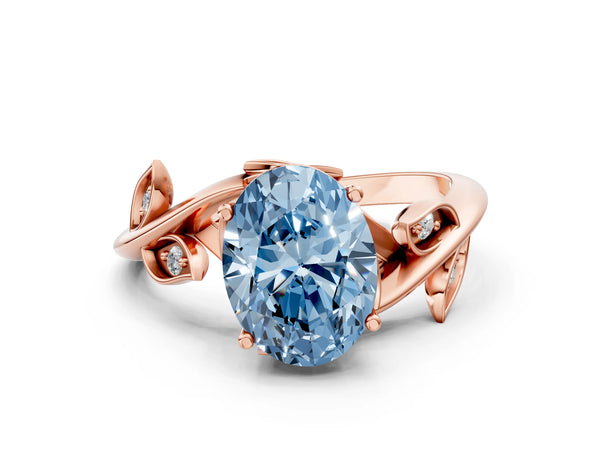 Rose gold Fancy Blue Oval Cut Solitaire Twist Engagement Ring with Leaf Accents and Prong Setting