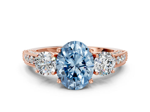 Rose gold Fancy Blue Oval Cut Three-Stone Diamond Ring with Pavé Band and Four-Prong Setting