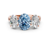 Rose gold Fancy Blue Oval Cut Three-Stone Diamond Ring with Prong Setting on a Classic Band_12