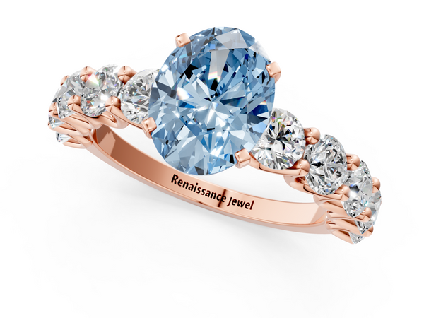 Rose gold Fancy Blue Oval Cut Diamond Prong Setting with Side Stones on a Pave Band