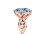 Rose gold Fancy Blue Oval  Solitaire Twist Band with Leaf Prong Setting