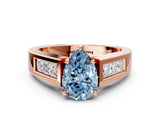 Rose gold Fancy Blue Pear Cut Cut Channel Set Solitaire Ring with Four-Prong Setting