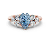 Rose gold Fancy Blue Pear  Cut Diamond Cluster Ring with Round Accent Stones and Prong Setting on a Classic Band_52