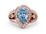 Rose gold Fancy Blue Pear Cut Diamond Halo Ring with Split Shank and Bezel Accents and Four-Prong Setting