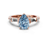 Rose gold Fancy Blue Pear  Cut Diamond Ring with Baguette Side Stones, Channel Set Band, and Four-Prong Setting_24