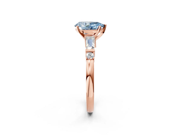 Rose gold Fancy Blue Pear  Cut Diamond Ring with Baguette Side Stones, Channel Set Band, and Four-Prong Setting