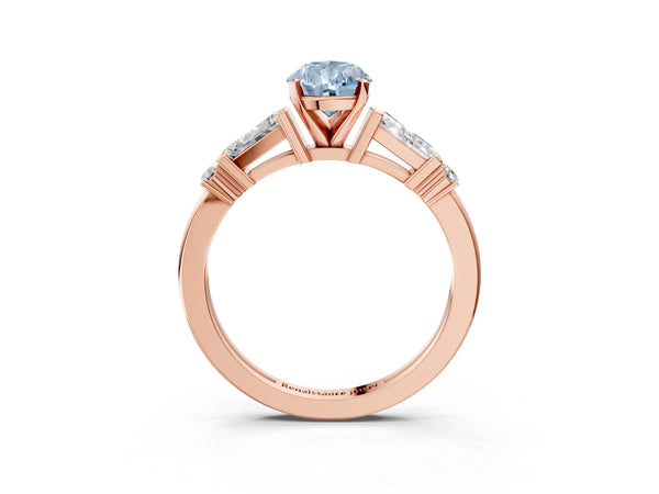 Rose gold Fancy Blue Pear  Cut Diamond Ring with Baguette Side Stones, Channel Set Band, and Four-Prong Setting