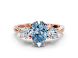 Rose gold Fancy Blue Pear Cut Diamond Three-Stone Engagement Ring with Prong Setting and Pavé Band
