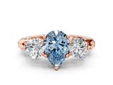 Rose gold Fancy Blue Pear Cut Diamond Three-Stone Ring with Prong Setting and Pavé Band