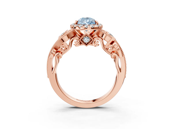 Rose gold Fancy Blue Pear Cut Halo Diamond Ring with Milgrain and Bezel Accents on a Split Shank Band