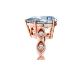 Rose gold Fancy Blue Pear Cut Solitaire Diamond Ring with Infinity Twist Band and Four-Prong Setting_5