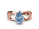 Rose gold Fancy Blue Pear  Cut Solitaire Diamond with Side Stones on Criss-Cross Band and Four-Prong Setting_3