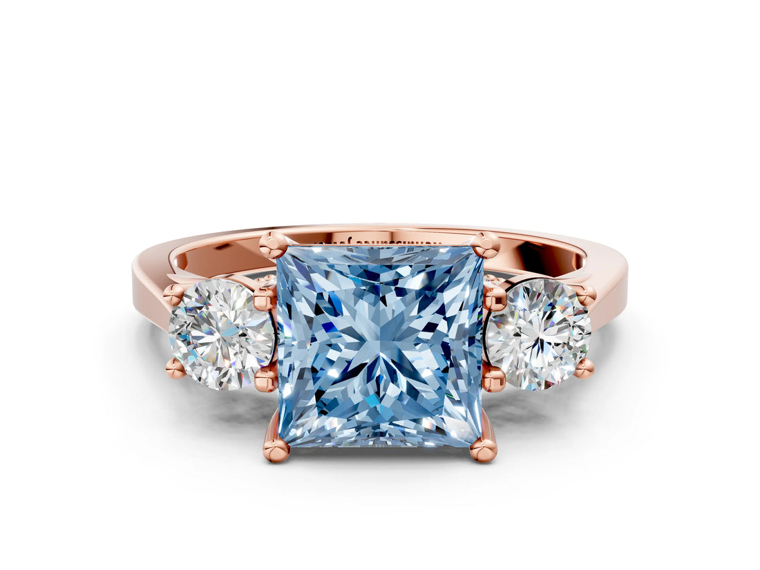 Rose gold Fancy Blue Princess Cut Diamond Three-Stone Engagement Ring with Prong Setting and Pavé Band