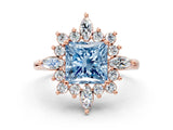 Rose gold Fancy Blue Princess Cut Halo Diamond Cluster Ring with Marquise and Round Stones on a White Gold Band with Prong Setting
