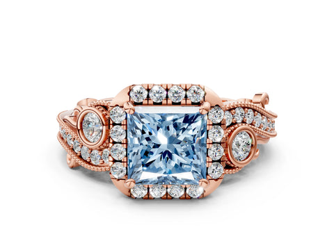 Rose gold Fancy Blue Princess Cut Halo Diamond Ring with Milgrain and Bezel Accents on a Split Shank Band