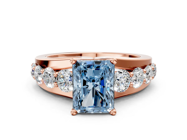 Rose gold Fancy Blue Radiant  Brilliant Solitaire with Side Stones on a Pave Band and Four-Prong Setting